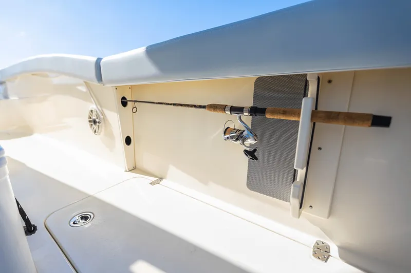 Slide: The Image of Fishing rod in holder aboard the 2027 Scout 260 LXF. - 38
