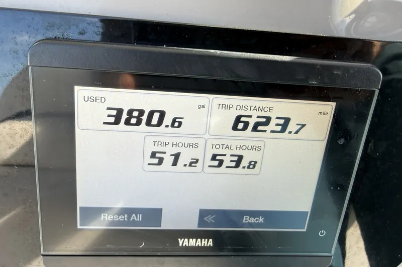 Slide: The Image of Display screen showing fuel usage and trip data on a 2023 Robalo 266 Cayman. - 18