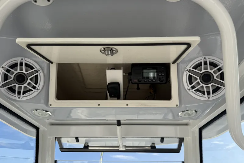 Slide: The Image of 2023 Robalo 266 Cayman boat console with speakers and electronic equipment. - 17