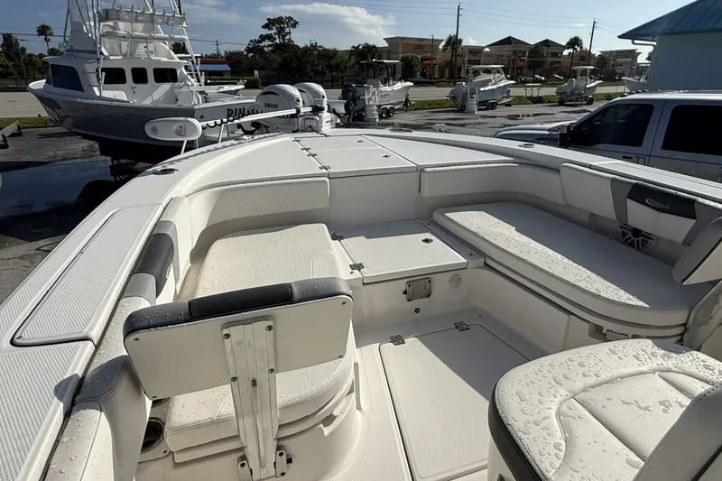 Slide: The Image of 2023 Robalo 266 Cayman boat interior with seating and storage compartments. - 20
