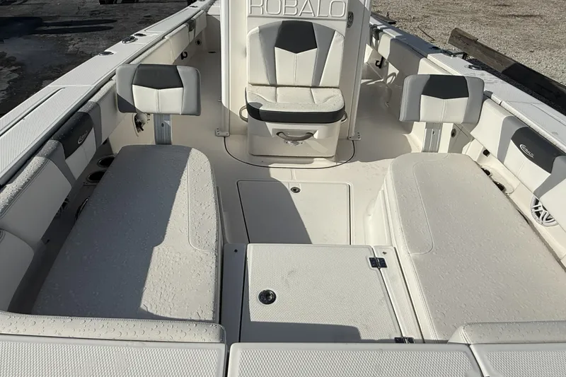 Slide: The Image of 2023 Robalo 266 Cayman boat interior with seating and storage compartments. - 19