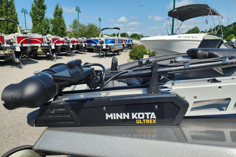 Slide: The Image of Minn Kota Ultrex motor on 2018 Crestliner PT 20 boat, with other boats in background. - 3