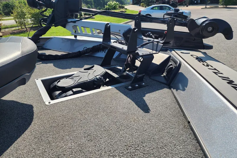 Slide: The Image of 2018 Crestliner PT 20 boat deck with mounted equipment and foot pedal controls. - 6