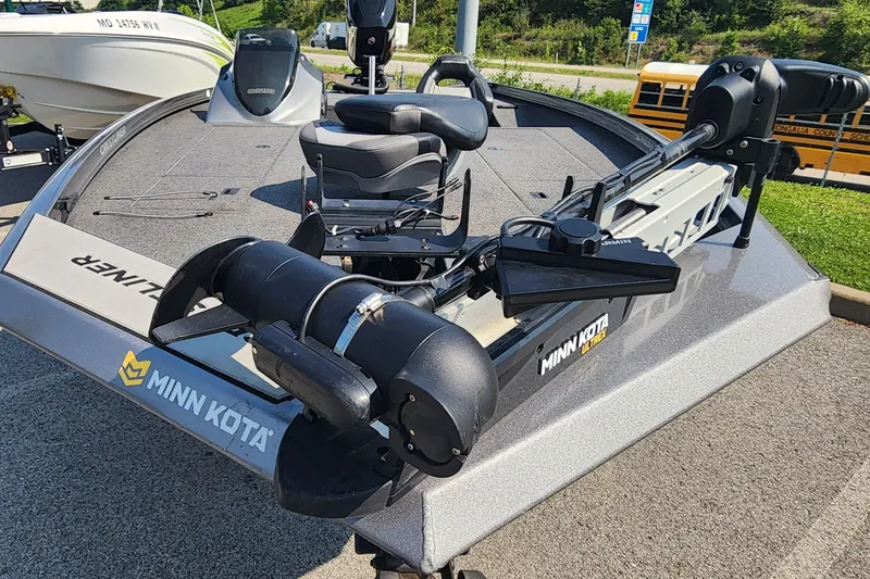 Slide: The Image of 2018 Crestliner PT 20 boat with Minn Kota trolling motor, parked outdoors. - 7