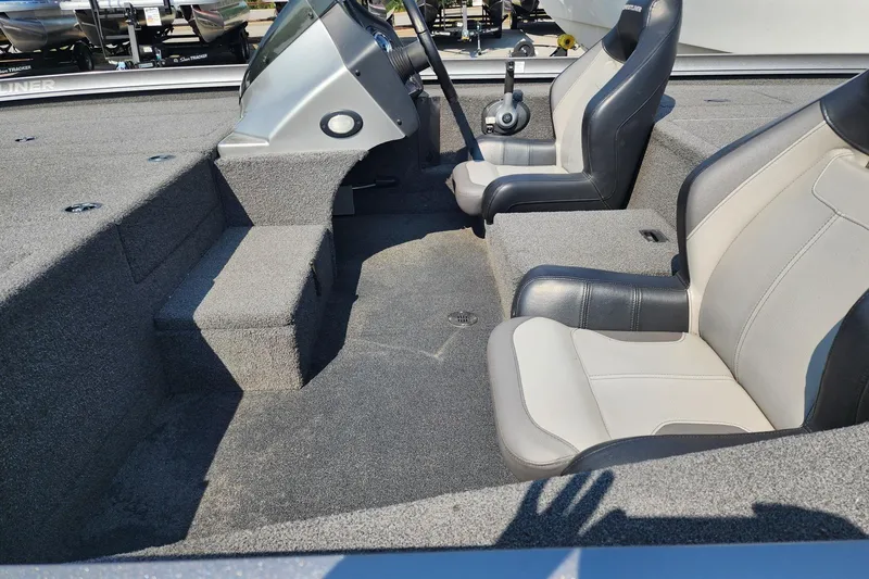 Slide: The Image of 2018 Crestliner PT 20 boat interior with dual seats and steering console. - 8