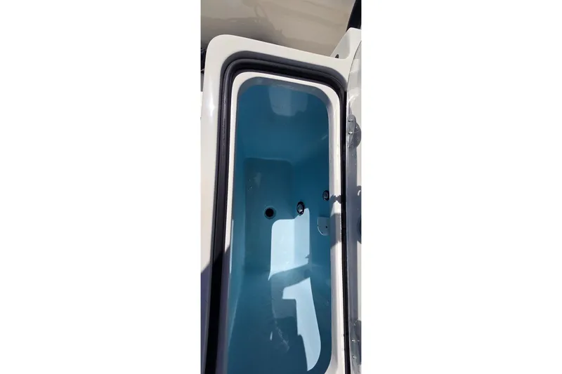 Slide: The Image of Open storage compartment of 2016 Ranger 2510 Bay Ranger boat. - 11