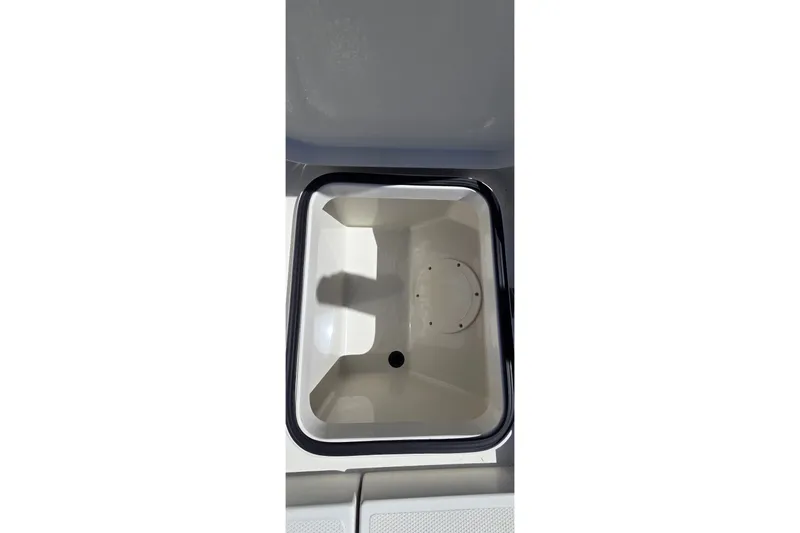 Slide: The Image of Livewell compartment of 2016 Ranger 2510 Bay Ranger boat, open and empty. - 12