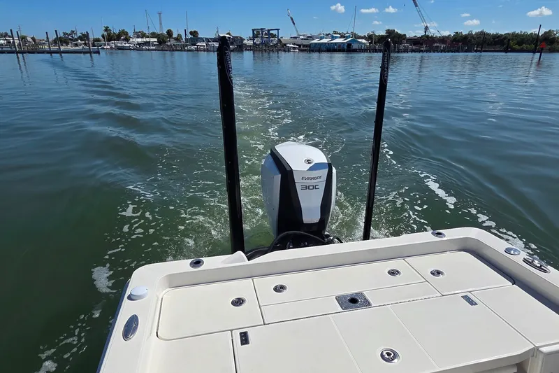 Slide: The Image of 2016 Ranger 2510 Bay Ranger boat with Evinrude 300 engine on calm water. - 7