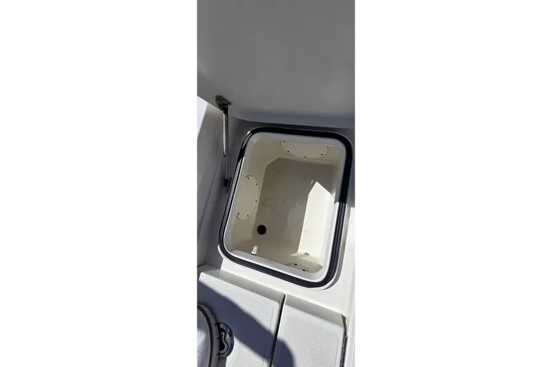 Slide: The Image of Open storage compartment on 2016 Ranger 2510 Bay Ranger boat. - 13