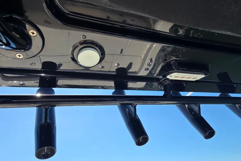 Slide: The Image of 2016 Ranger 2510 Bay Ranger boat detail with rod holders and light fixture. - 38