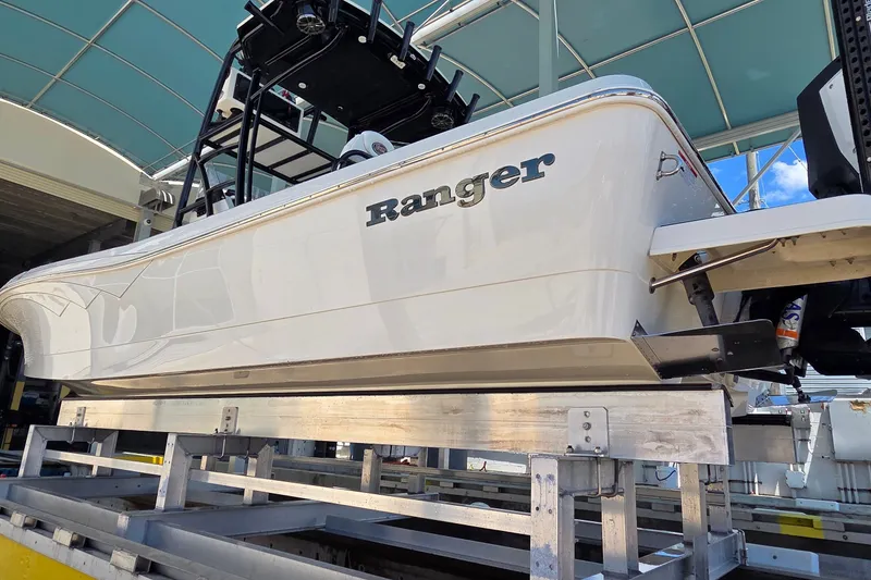 Slide: The Image of 2016 Ranger 2510 Bay Ranger boat on a lift under a canopy. - 62