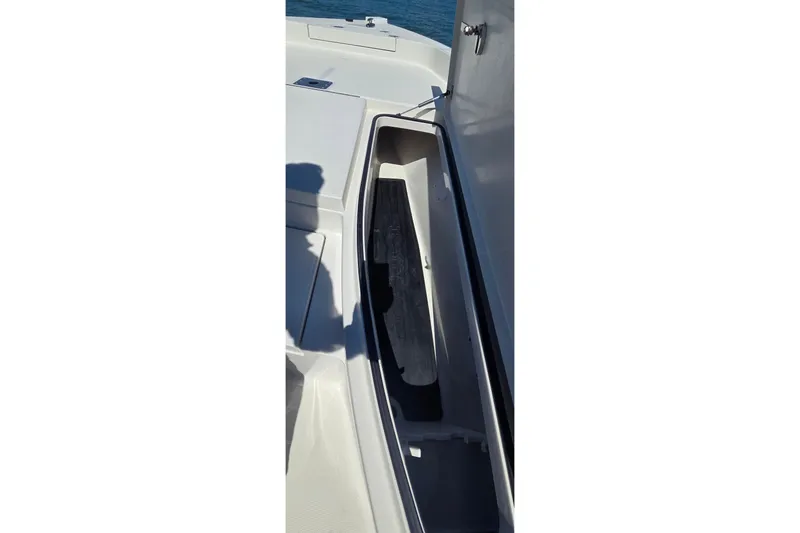 Slide: The Image of Open storage compartment on 2016 Ranger 2510 Bay Ranger boat. - 28