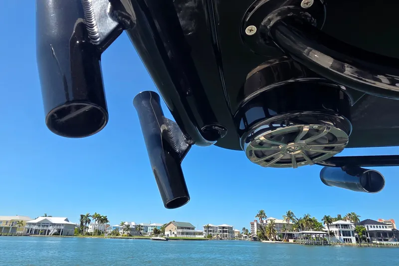 Slide: The Image of 2016 Ranger 2510 Bay Ranger boat with rod holders and speaker, coastal view. - 37