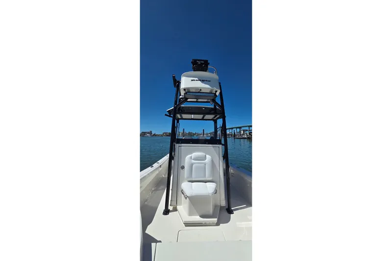 Slide: The Image of 2016 Ranger 2510 Bay Ranger boat with seating and tower on calm water. - 48