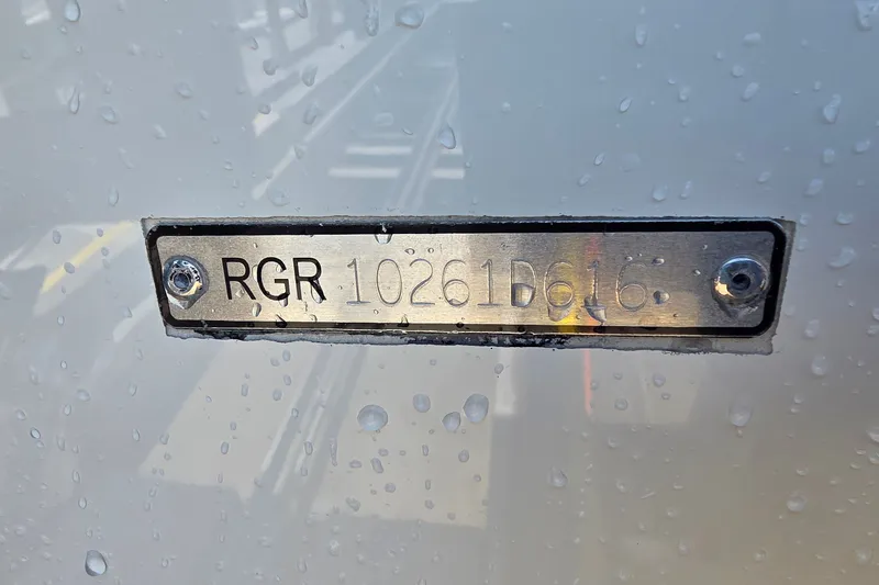 Slide: The Image of 2016 Ranger 2510 Bay Ranger hull identification number plate with water droplets. - 54