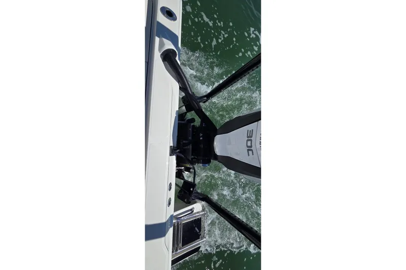 Slide: The Image of 2016 Ranger 2510 Bay Ranger boat motor on water, top view. - 14