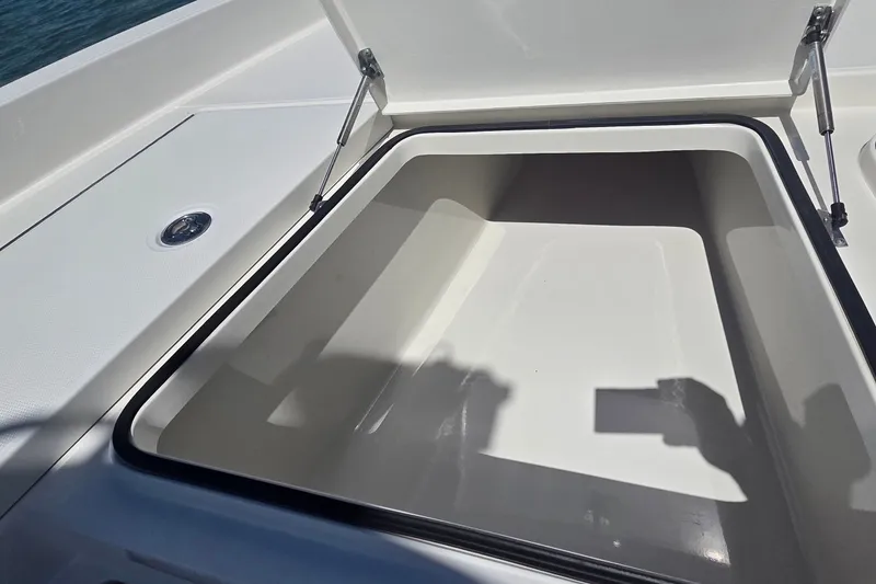 Slide: The Image of Open storage compartment on a 2016 Ranger 2510 Bay Ranger boat. - 32