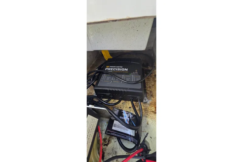 Slide: The Image of Minn Kota Precision charger in 2016 Ranger 2510 Bay Ranger boat compartment. - 19