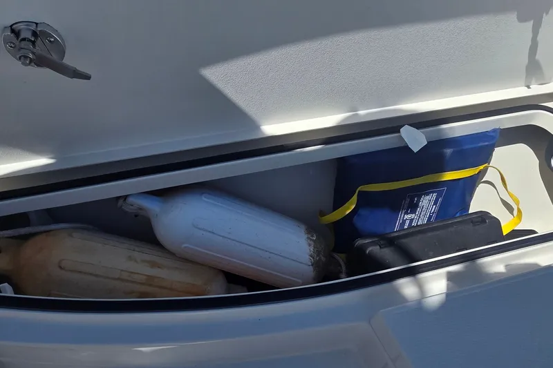 Slide: The Image of Storage compartment of 2016 Ranger 2510 Bay Ranger with fenders and gear. - 30