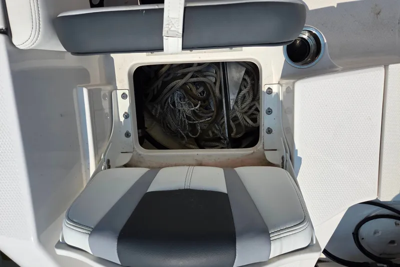 Slide: The Image of Storage compartment with ropes on a 2025 Robalo R180 Center Console boat. - 27