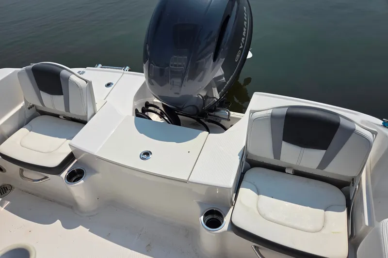 Slide: The Image of 2025 Robalo R180 Center Console boat with dual seating and Yamaha outboard motor. - 28