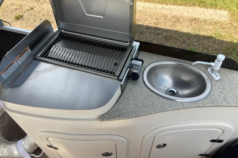 Slide: The Image of Outdoor kitchen setup on 2011 AquaPatio AP250W6 with grill and sink. - 10