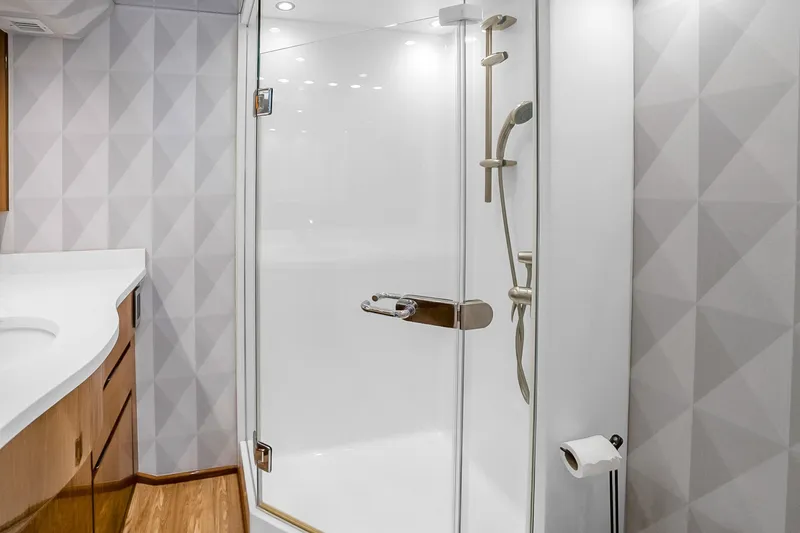 Slide: The Image of Luxurious bathroom in 2012 Viking 76 Convertible yacht with modern shower and sleek design. - 91