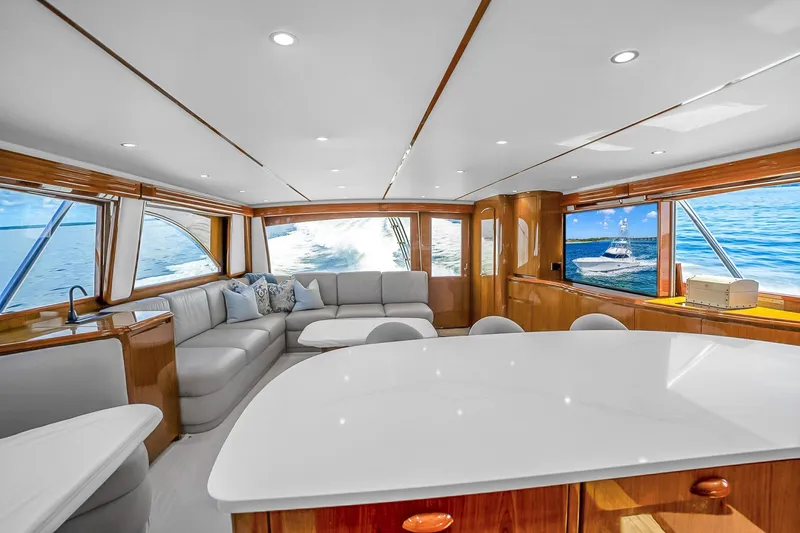 Slide: The Image of Luxurious interior of 2012 Viking 76 Convertible yacht with elegant seating and ocean views. - 72