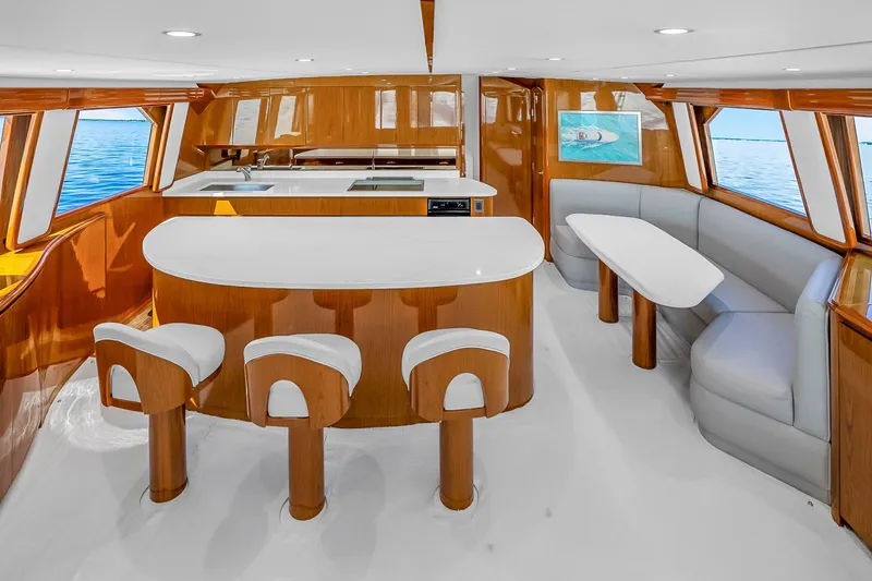 Slide: The Image of Luxurious interior of 2012 Viking 76 Convertible yacht with modern kitchen and seating area. - 67