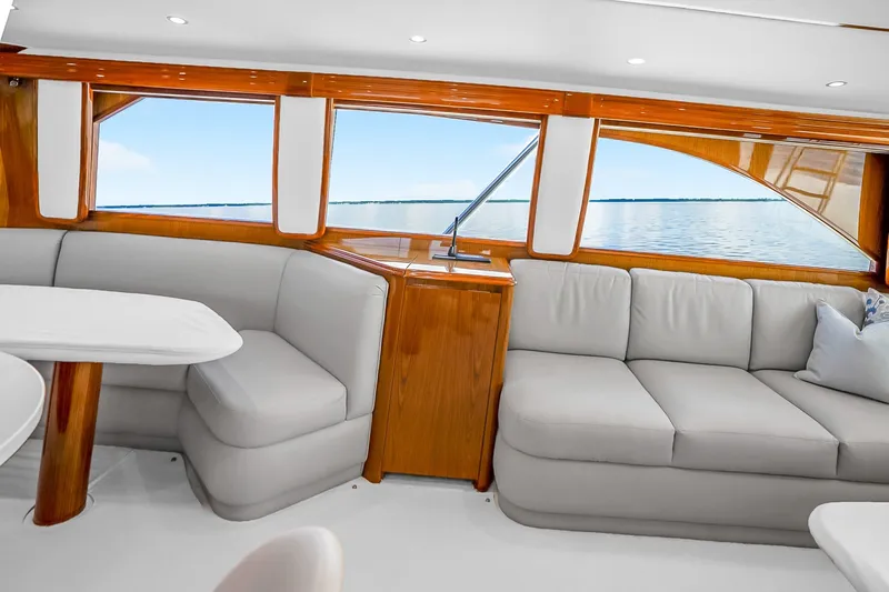 Slide: The Image of Luxurious interior of 2012 Viking 76 Convertible yacht with plush seating and ocean view. - 65
