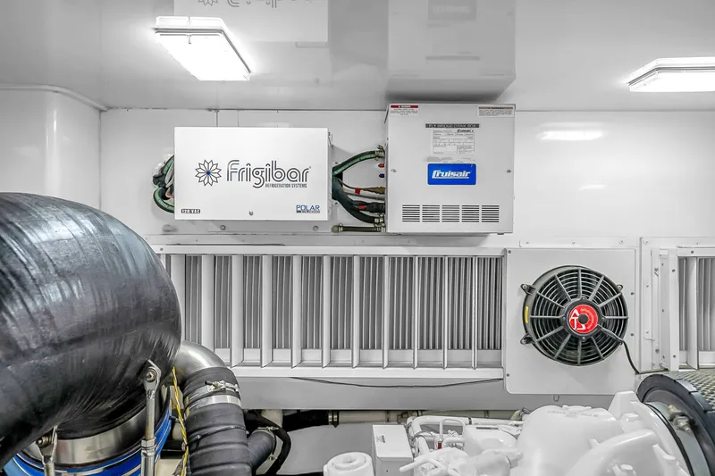 Slide: The Image of Engine room of 2012 Viking 76 Convertible with Frigibar refrigeration system. - 134