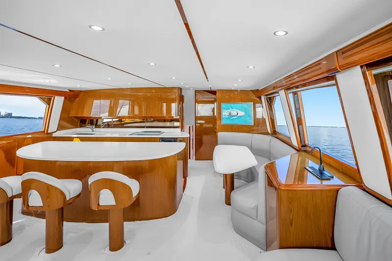 Slide: The Image of Luxurious interior of a 2012 Viking 76 Convertible yacht with elegant wood finishes. - 66