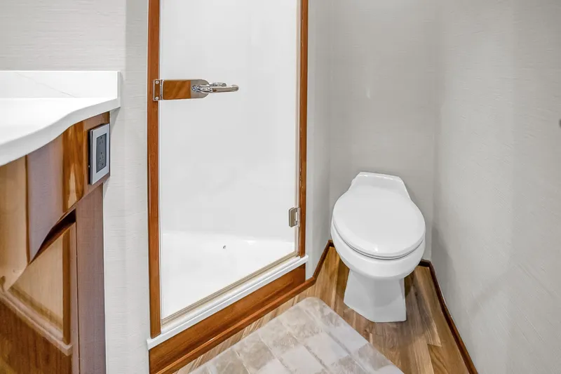 Slide: The Image of Bathroom interior of 2012 Viking 76 Convertible yacht with shower and toilet. - 110