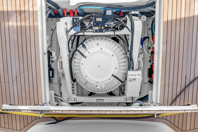 Slide: The Image of Engine compartment of a 2012 Viking 76 Convertible yacht with wooden deck panels. - 138