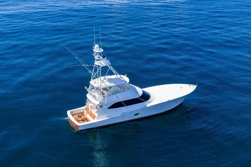 Slide: The Image of Luxury 2012 Viking 76 Convertible yacht cruising on open blue waters. - 31