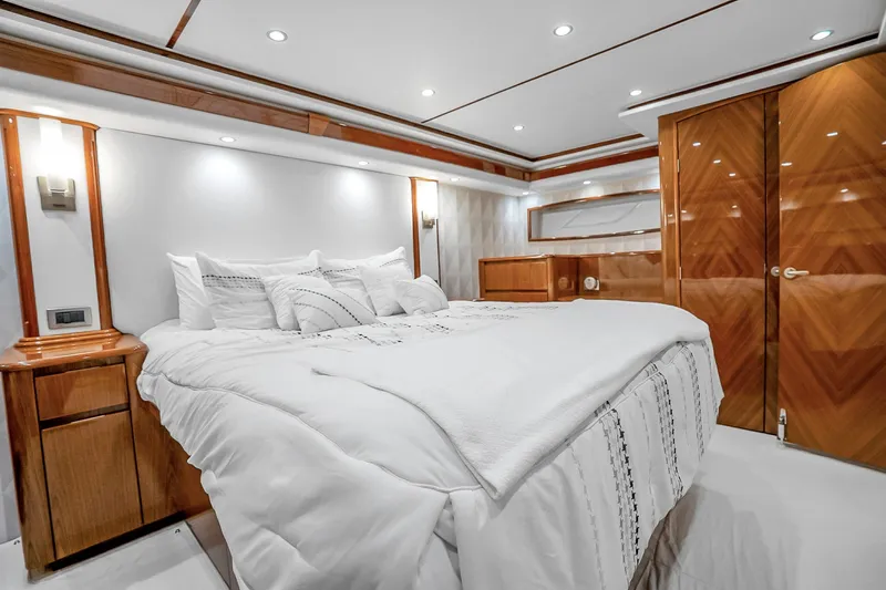 Slide: The Image of Luxurious bedroom interior of 2012 Viking 76 Convertible yacht with elegant wood finishes. - 94