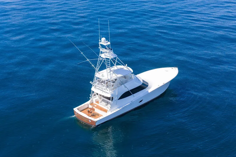 Slide: The Image of Aerial view of 2012 Viking 76 Convertible yacht on open blue sea. - 30