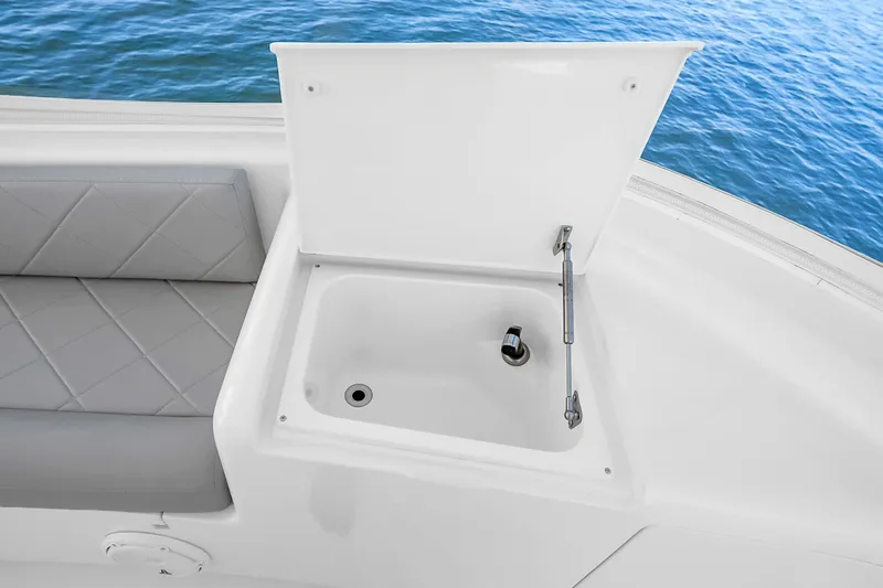 Slide: The Image of Open storage compartment on 2012 Viking 76 Convertible yacht, with cushioned seating and ocean view. - 40
