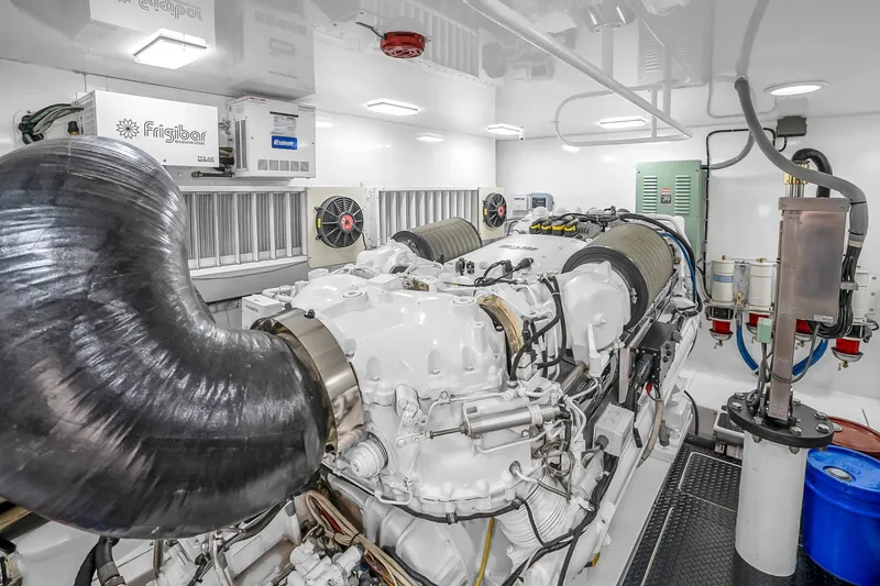 Slide: The Image of Engine room of a 2012 Viking 76 Convertible yacht, featuring advanced machinery and equipment. - 123