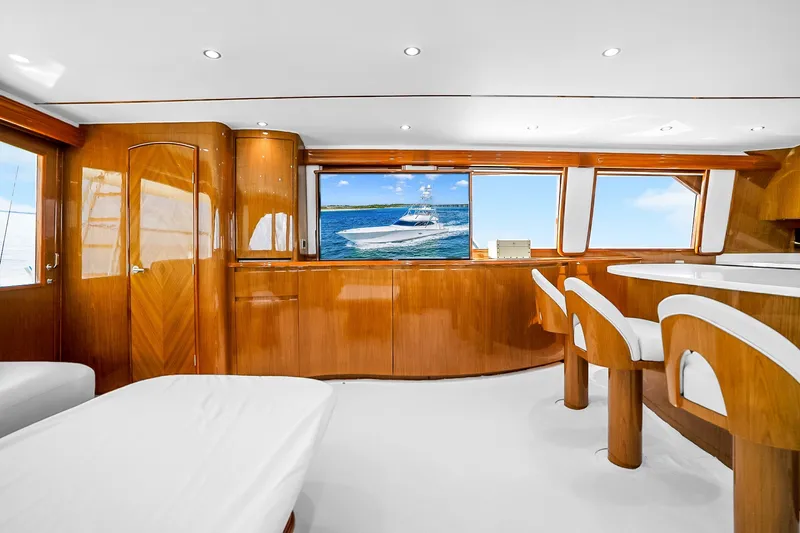 Slide: The Image of Luxurious interior of 2012 Viking 76 Convertible yacht with elegant wood finish and ocean view. - 62