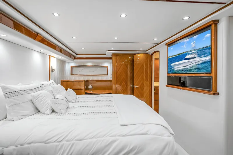 Slide: The Image of Luxurious bedroom interior of 2012 Viking 76 Convertible yacht with elegant wood finishes. - 85