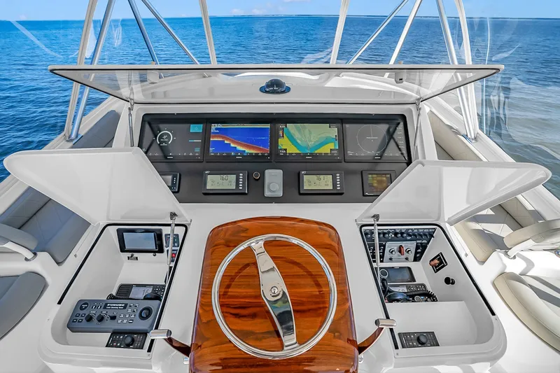 Slide: The Image of Helm of 2012 Viking 76 Convertible yacht with advanced navigation systems and ocean view. - 33