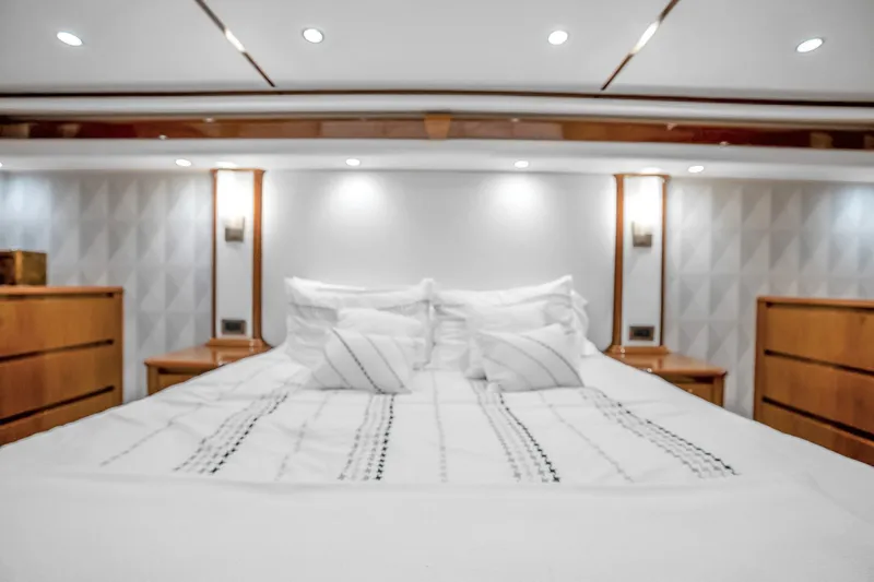 Slide: The Image of Luxurious bedroom interior of 2012 Viking 76 Convertible yacht with elegant wood accents. - 95