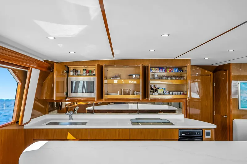 Slide: The Image of Luxurious kitchen interior of 2012 Viking 76 Convertible yacht with modern amenities. - 70