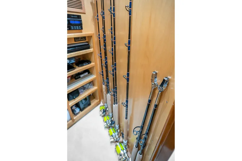 Slide: The Image of Fishing rods stored in a 2012 Viking 76 Convertible yacht interior. - 76