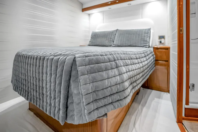 Slide: The Image of Luxurious bedroom interior of 2012 Viking 76 Convertible yacht with elegant bedding. - 102