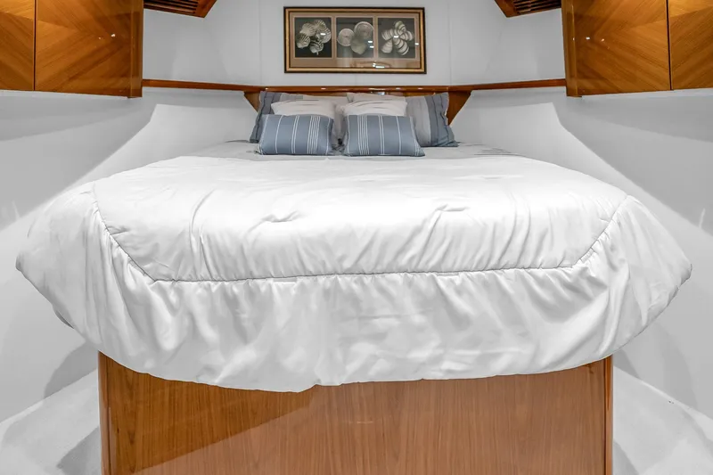 Slide: The Image of Luxurious bedroom interior of 2012 Viking 76 Convertible yacht with elegant bedding. - 106