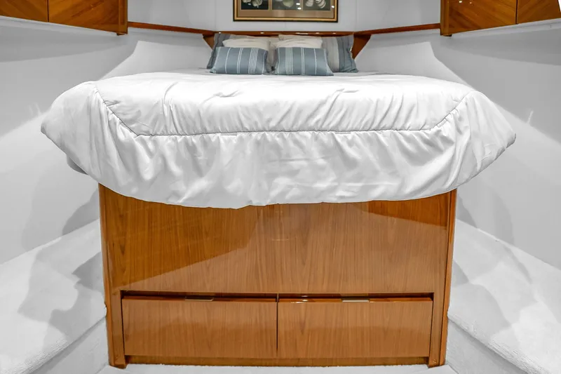 Slide: The Image of Luxurious bedroom interior of 2012 Viking 76 Convertible yacht with elegant wood finish. - 107