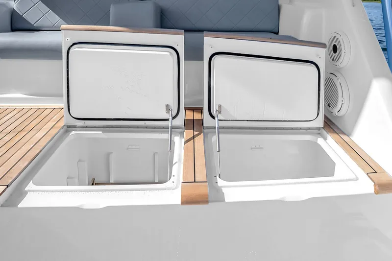 Slide: The Image of Open storage compartments on a 2012 Viking 76 Convertible yacht deck. - 44