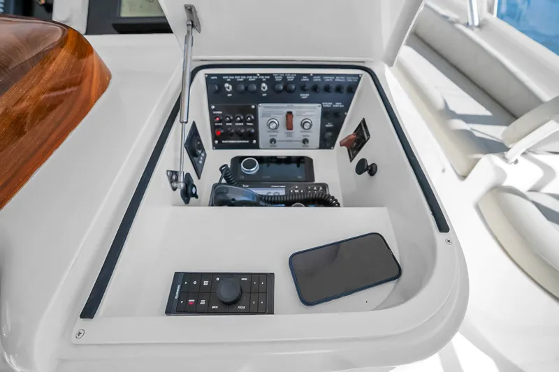 Slide: The Image of Control panel of a 2012 Viking 76 Convertible yacht with navigation equipment. - 37